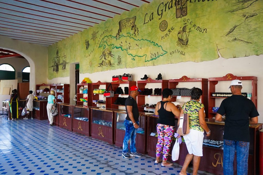 People Waiting in Line For Empty Grocery store in Cuba