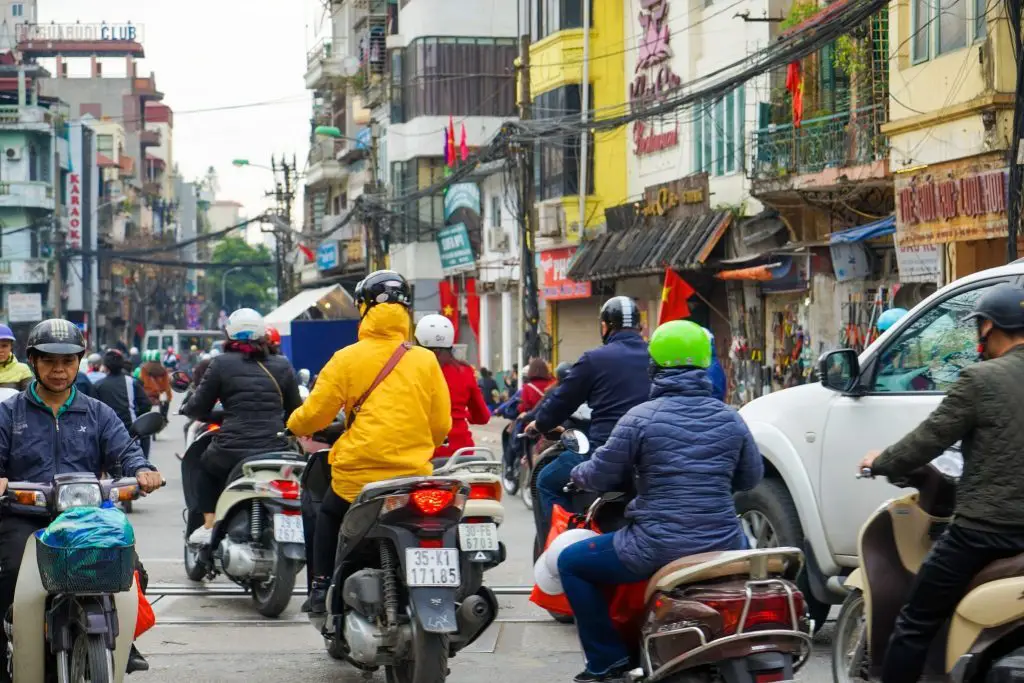 places to visit in hanoi - Hanoi Scooter Traffic